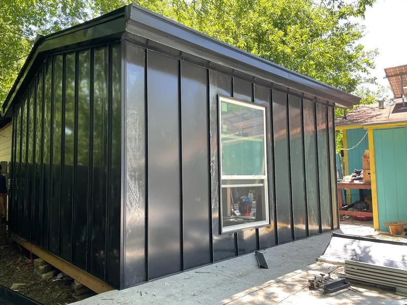 Black standing seam metal wall panels for Roof Inspection in Tigard